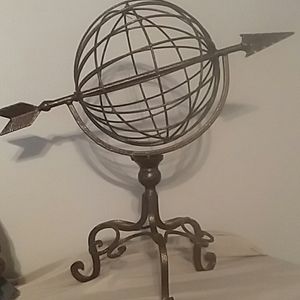 Metal Art globe with arrow